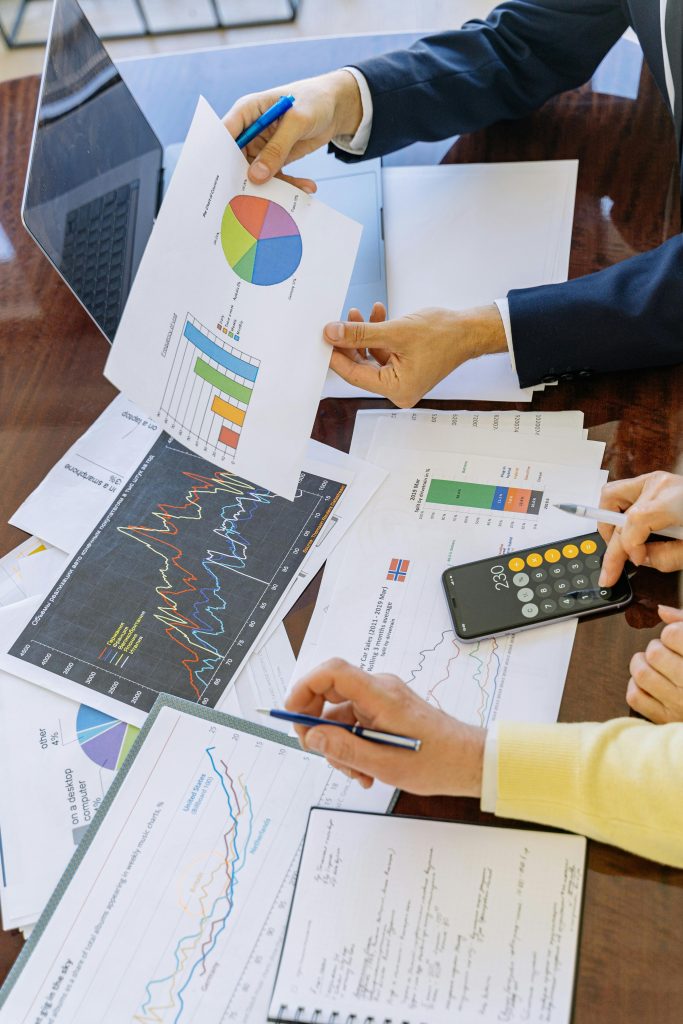 pexels photo 5816283 5816283 Business professionals analyzing financial charts and graphs during a meeting.